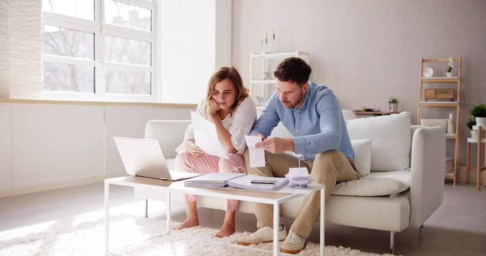 Couple Examining Some Documents