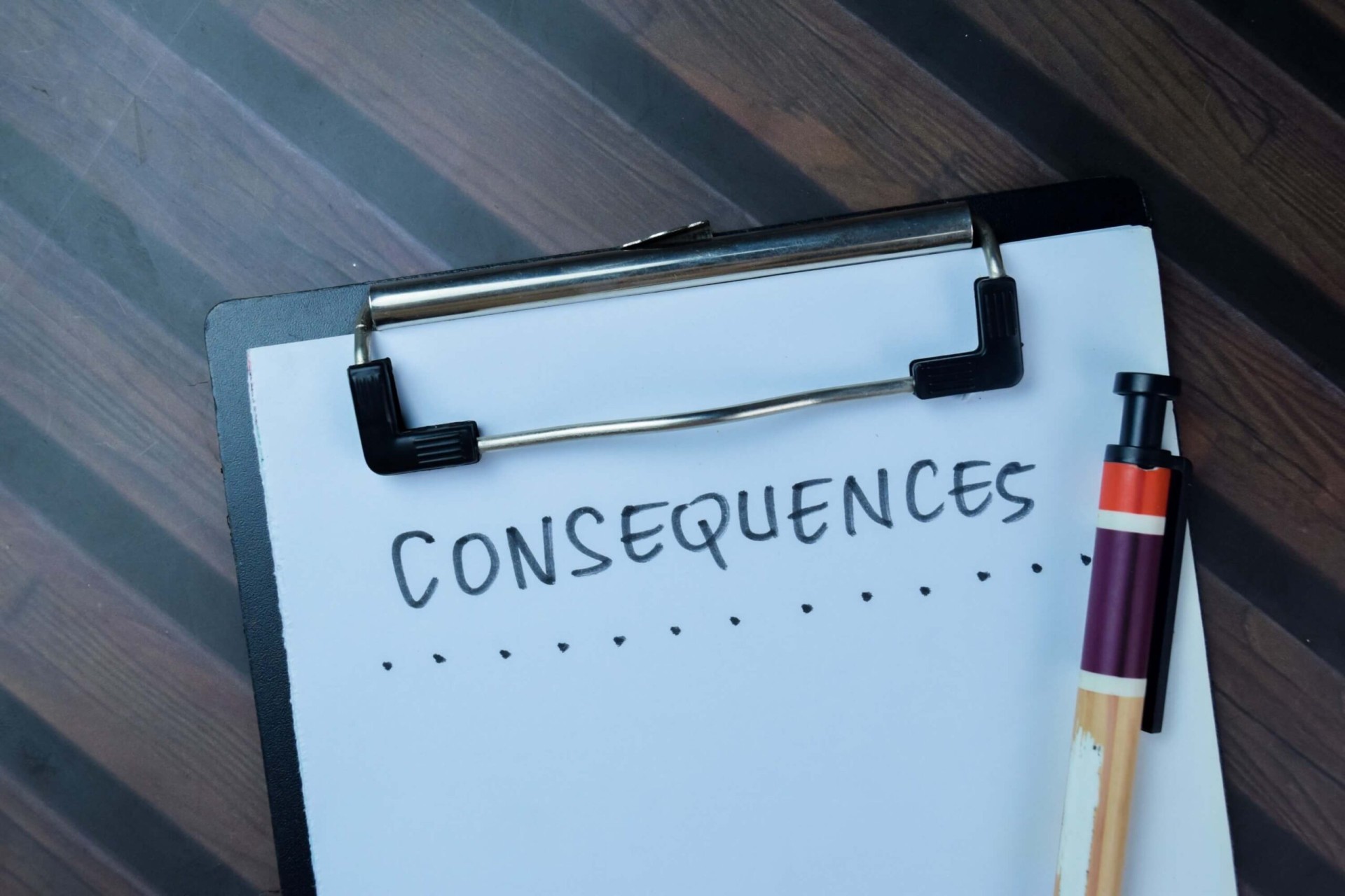 Consequences concept written on paperwork