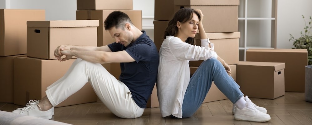 Two people siting on the floor